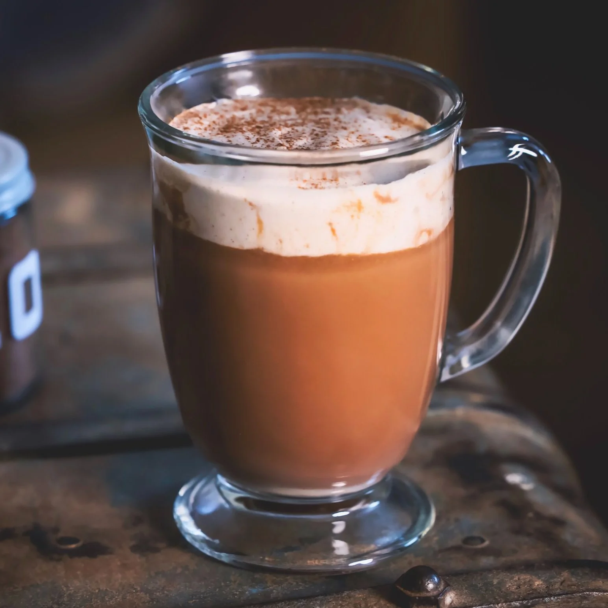 A glass mug of LOCOCO with a whipped top