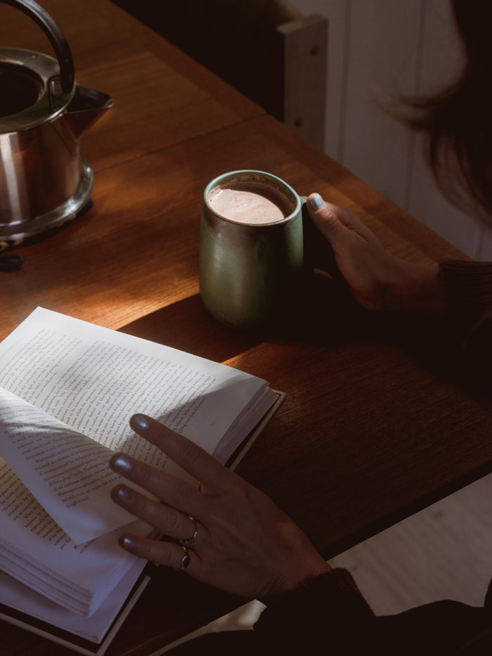 An afternoon cup of LOCOCO beside an open book