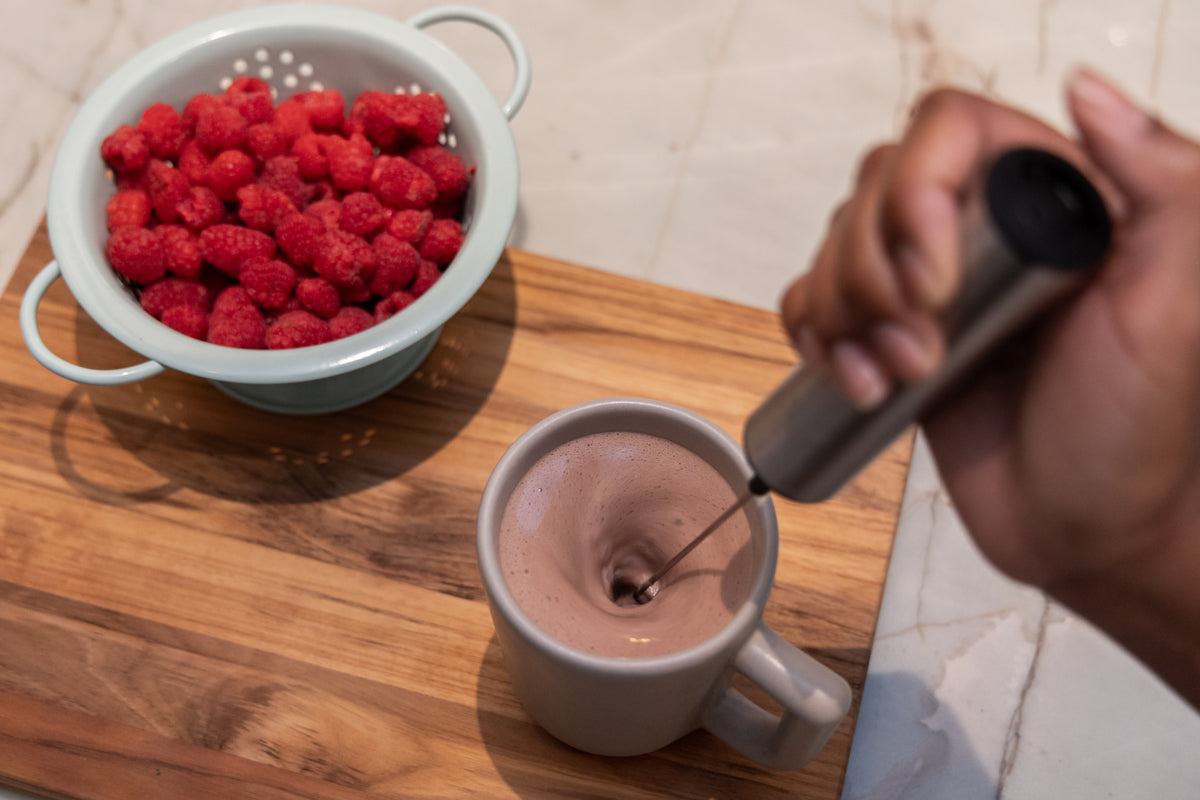 The LOCOCO frother blending a cup of cocoa