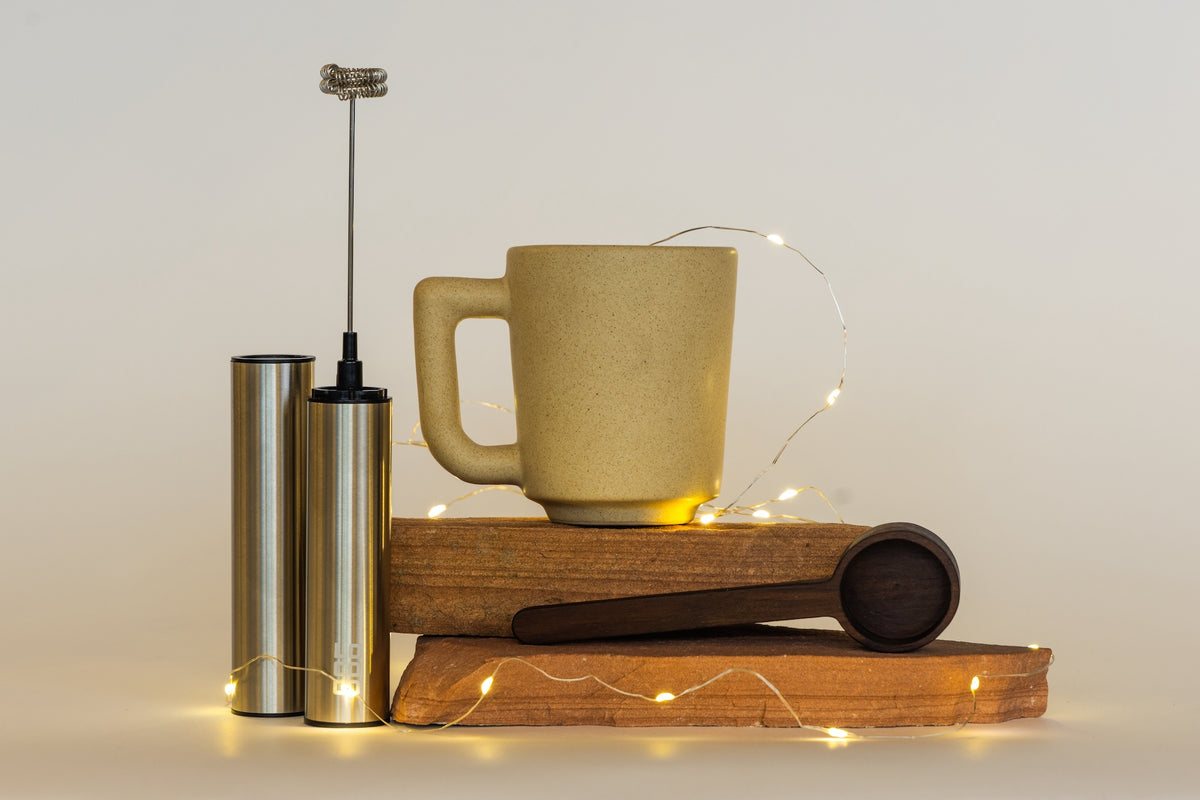 The LOCOCO Ritual Kit: cocoa, a frother, a scoop and a ceramic mug