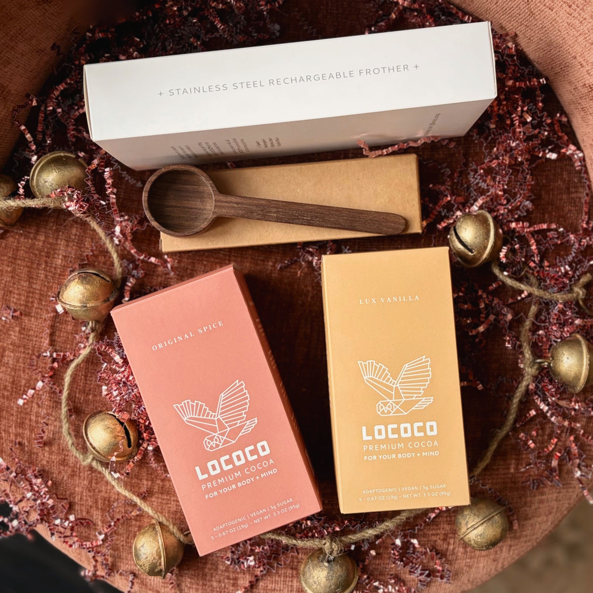 The Cocoa Bundle Kit: Original Spice and Lux Vanilla to-go sachets, the LOCOCO frother and a wooden scoop