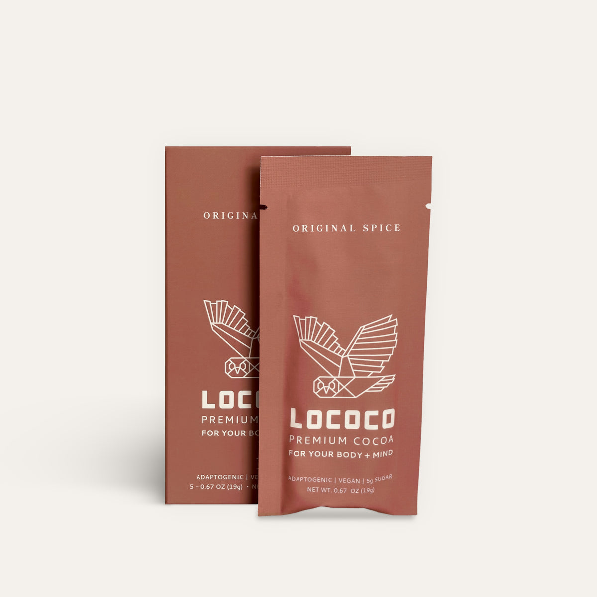 A box of LOCOCO Original Spice to-go cocoa sachets with one sachet in front